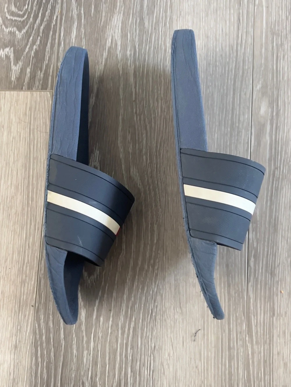 Tommy Hilfiger Navy Slides with Red It doesn't have a number but it's like a 10